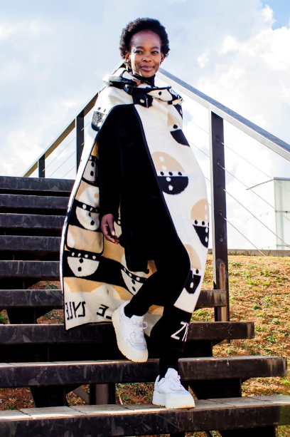 Unity Throw — reverse face of the Idzila motif